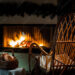 empty chair in front of a fireplace